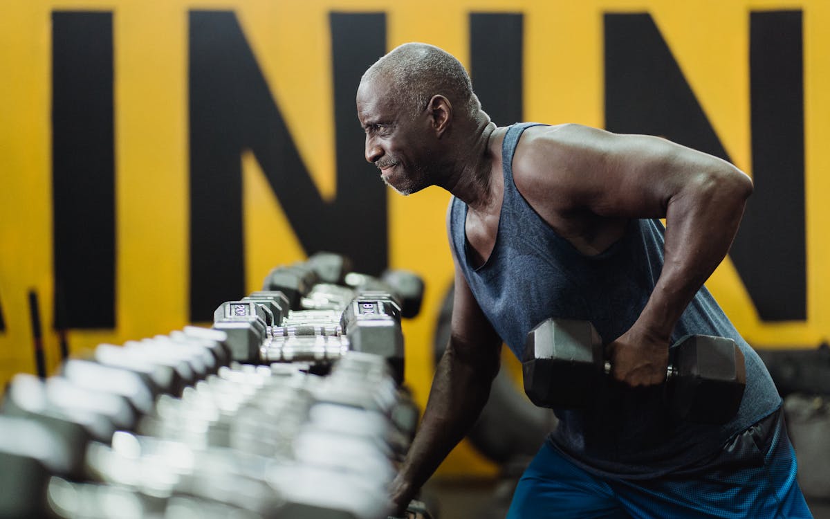 Mature man training with weights at home — body transformation programming for men over 40